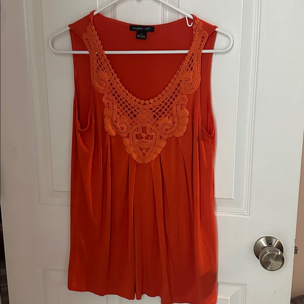 August Silk size M Orange  sleeveless top with lacr Accent and boat neck.
